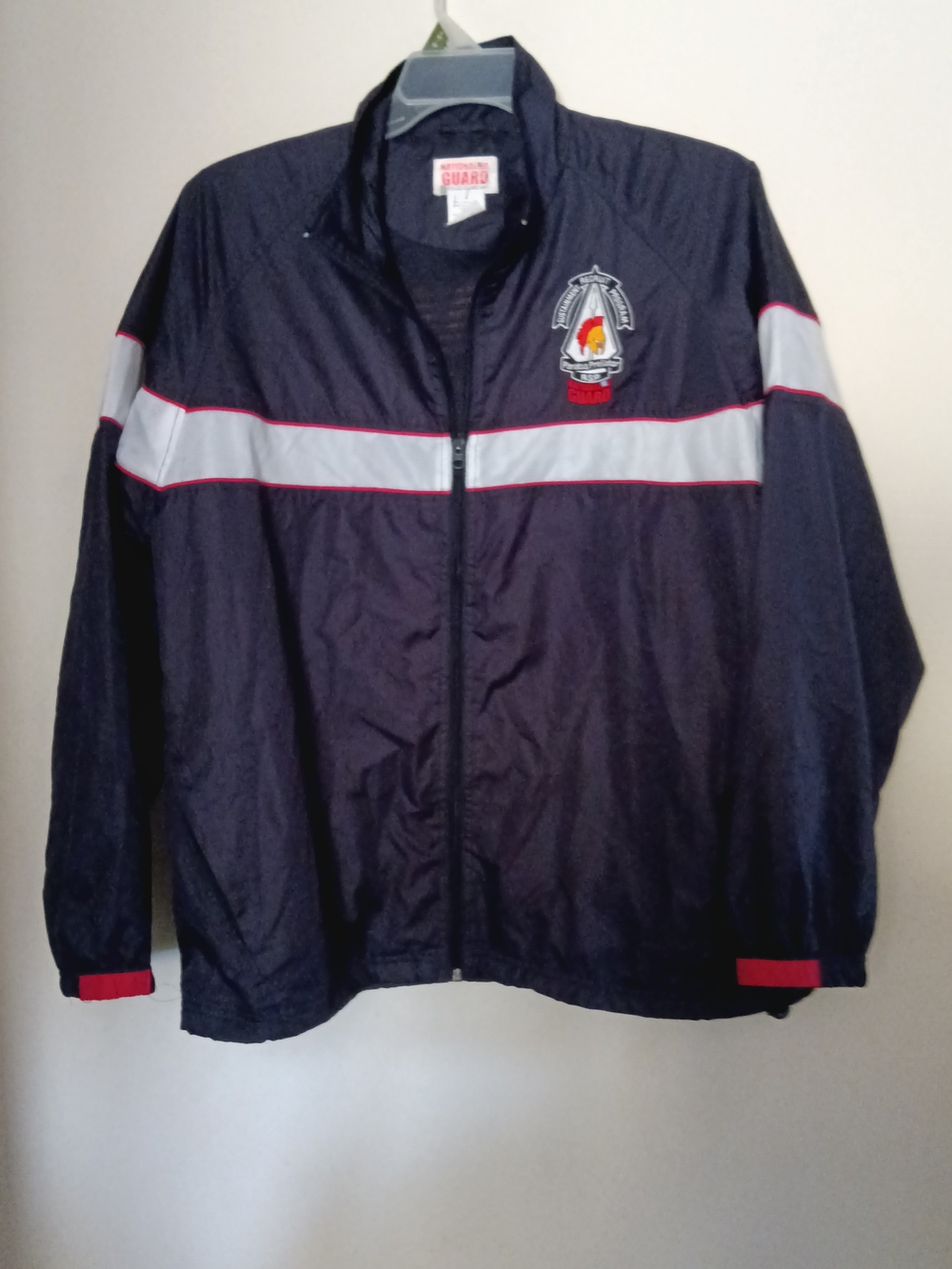 Navy Windbreaker Jacket with Reflective White Stripe and Red Trim